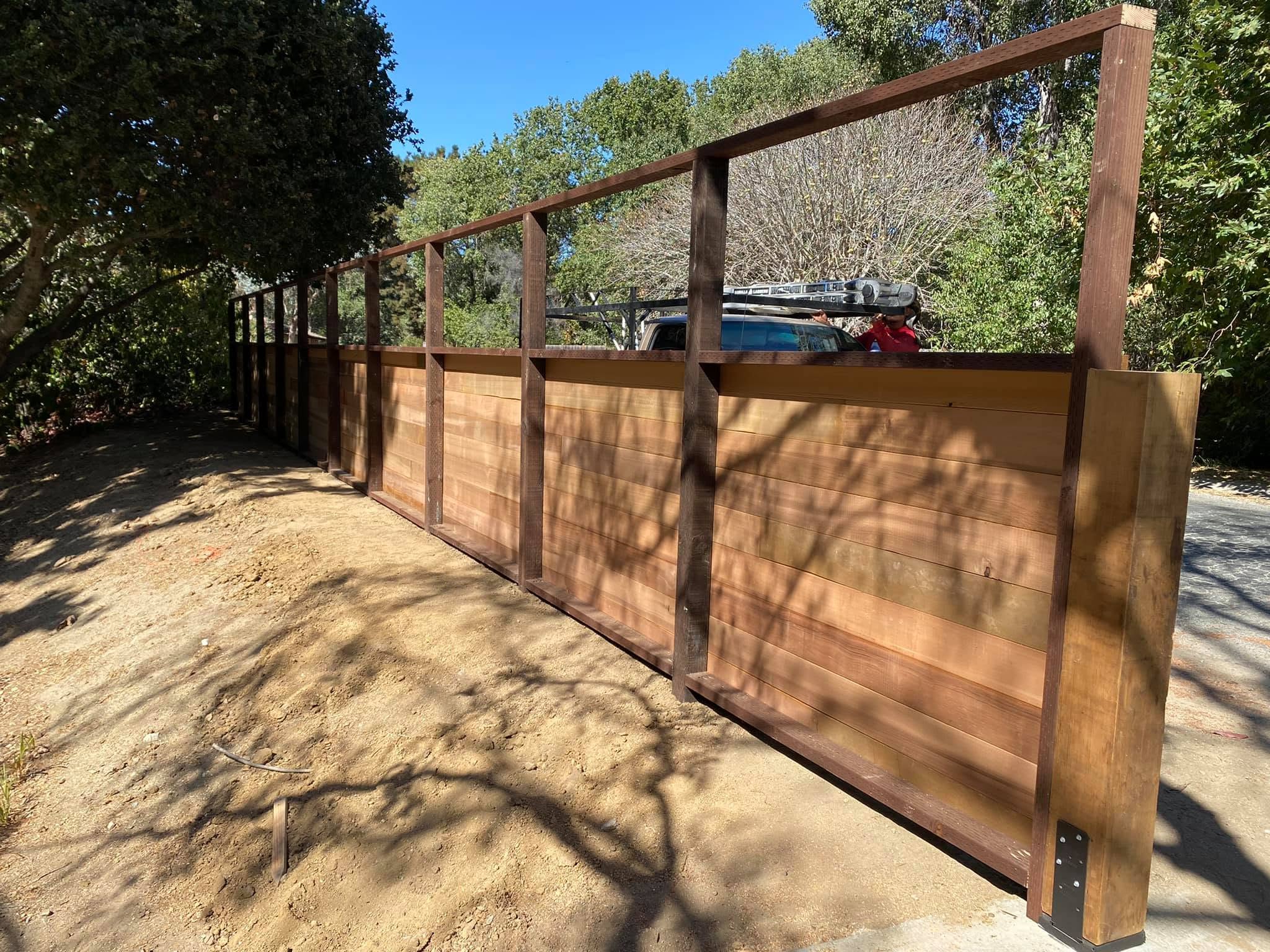 Long two-tone horizontal board fence