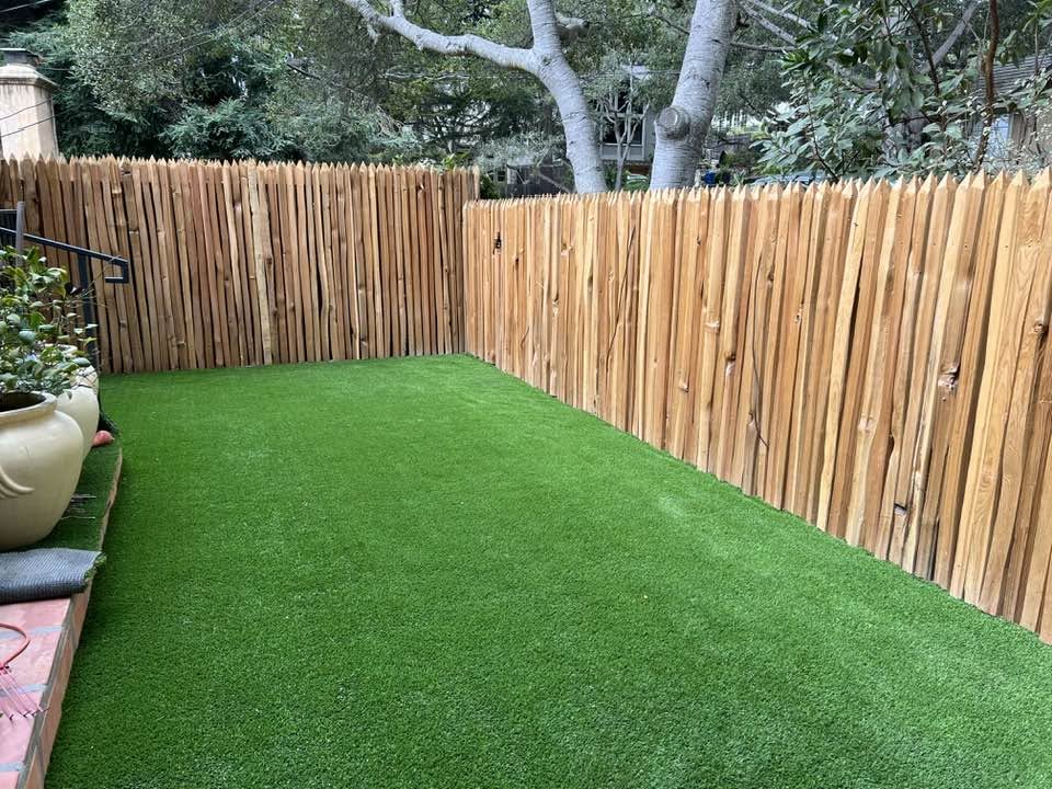 Rustic fence with artificial turf lawn