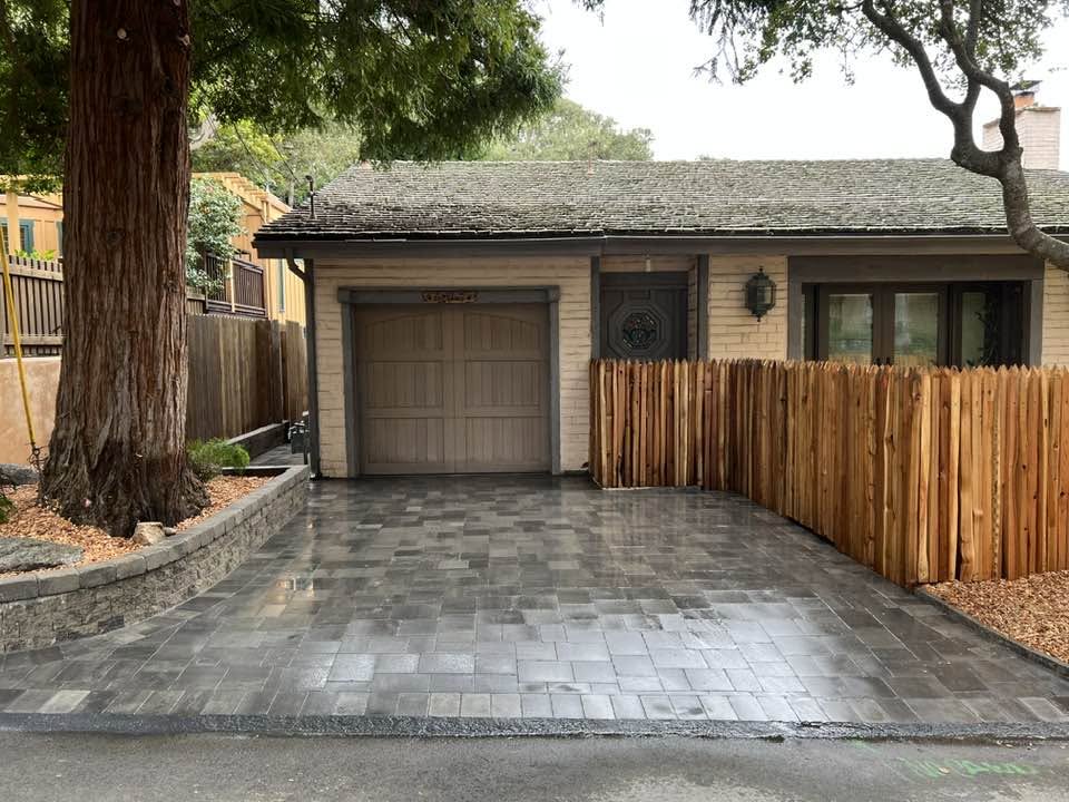 Paver driveway with new cedar fence